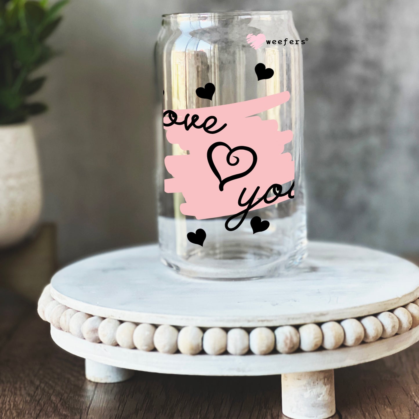 a mason jar with a sticker that says one love you