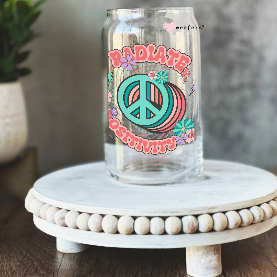 a glass jar with a peace sign painted on it