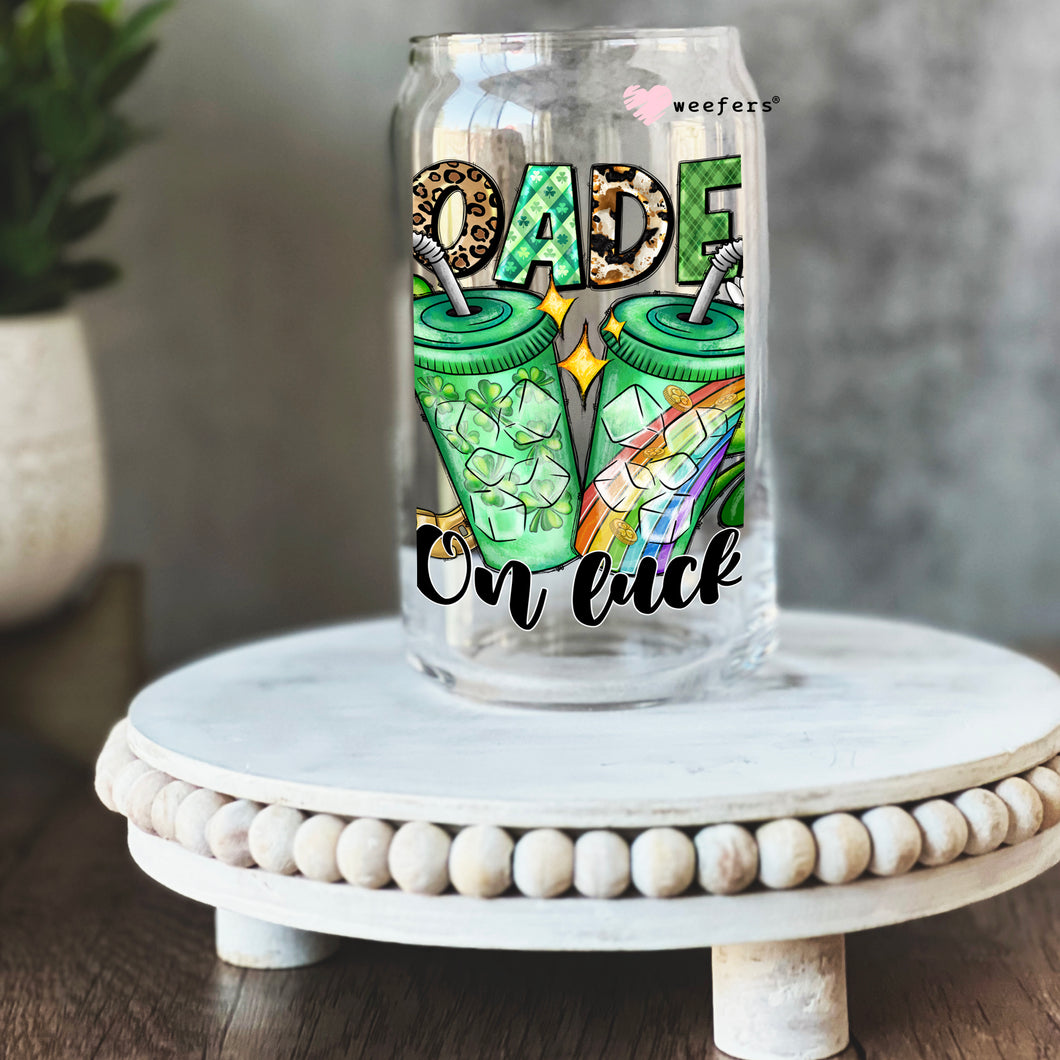 a glass jar with a picture of two green owls on it