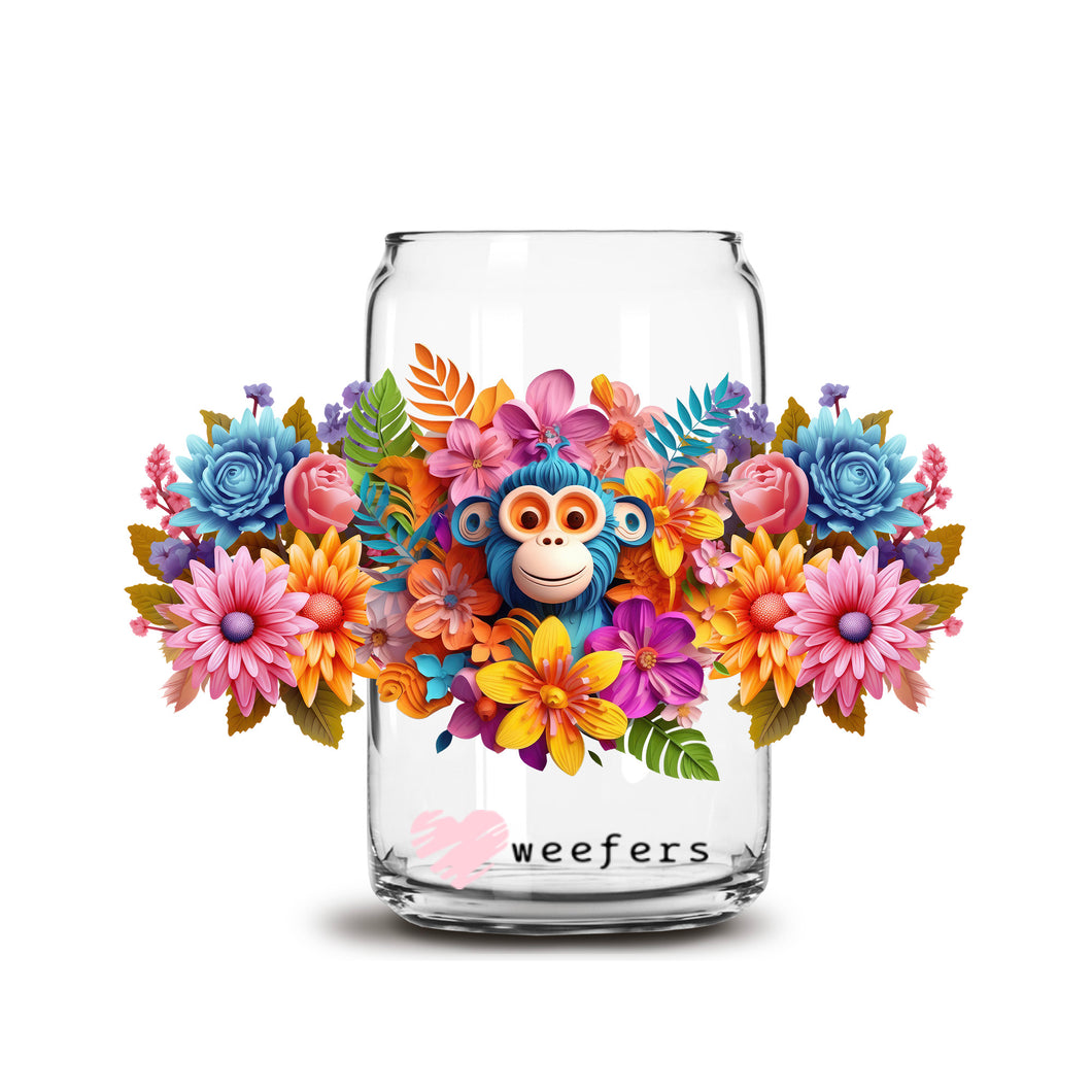 a glass jar with flowers and a monkey on it