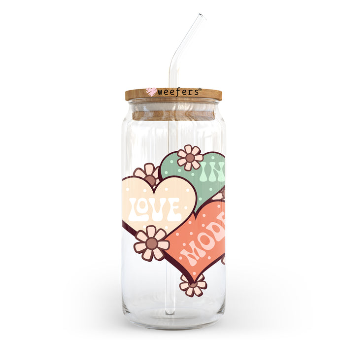 a glass jar with a straw in the shape of a heart