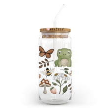 Load image into Gallery viewer, a glass jar with a frog and a butterfly on it
