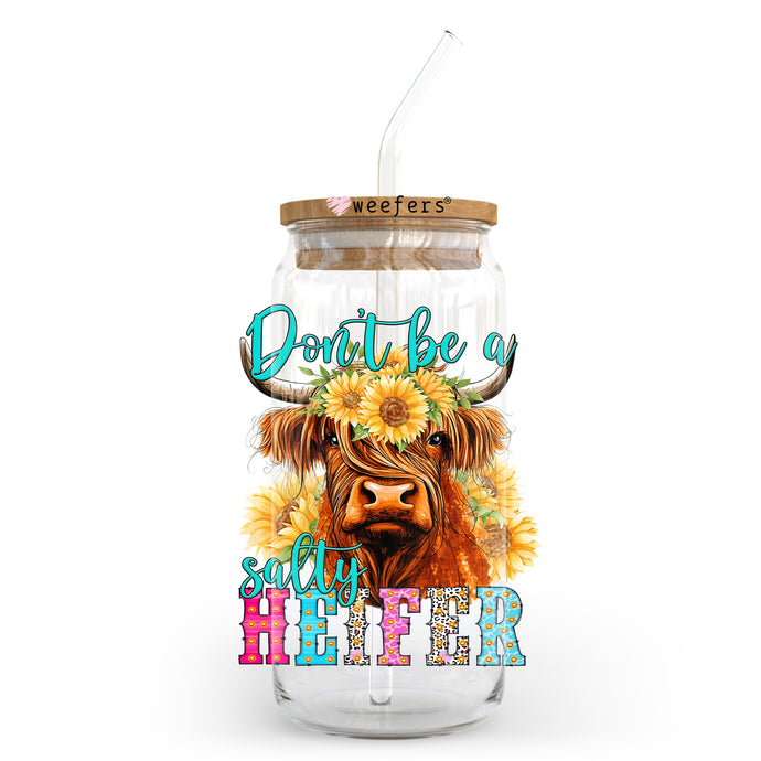 a glass jar with a cow and sunflowers on it