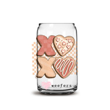 Load image into Gallery viewer, a glass jar filled with cookies on top of a white surface
