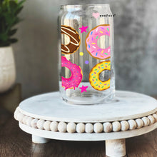 Load image into Gallery viewer, a glass jar with donuts painted on it
