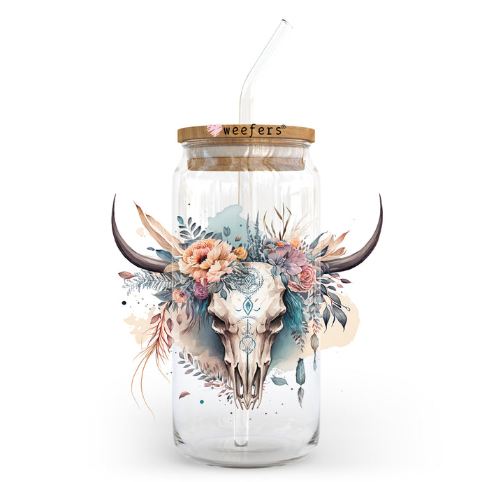 a glass jar with a cow skull and flowers painted on it