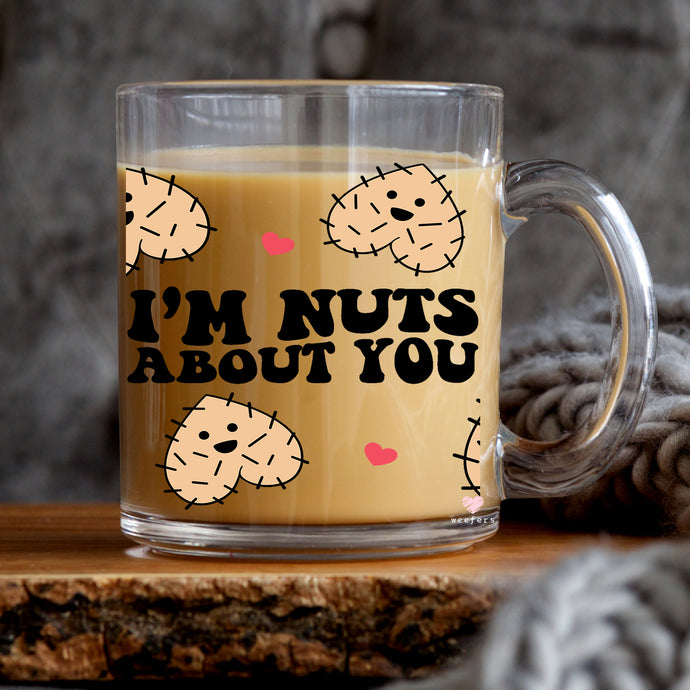 a glass mug that says i'm nuts about you