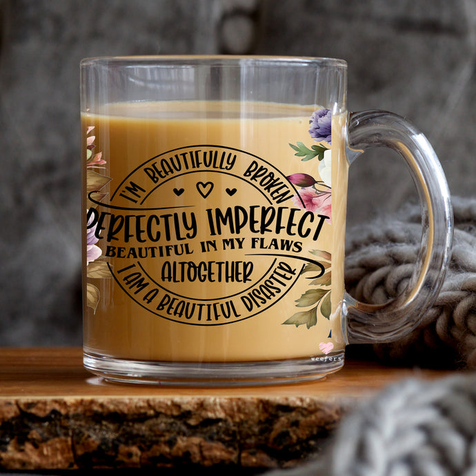 a glass mug with a quote on it