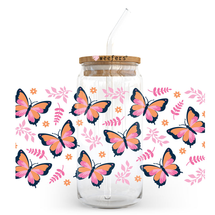 a glass jar with a straw in it with a butterfly design on it