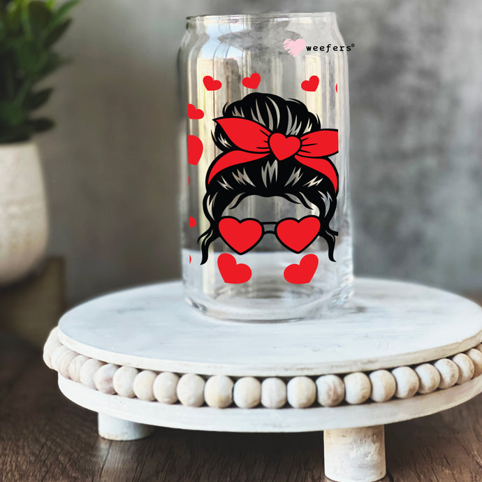 a glass jar with a picture of a girl wearing a red bow