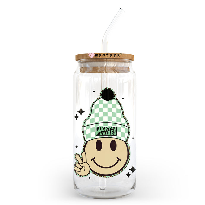 a glass jar with a smiley face and a straw sticking out of it