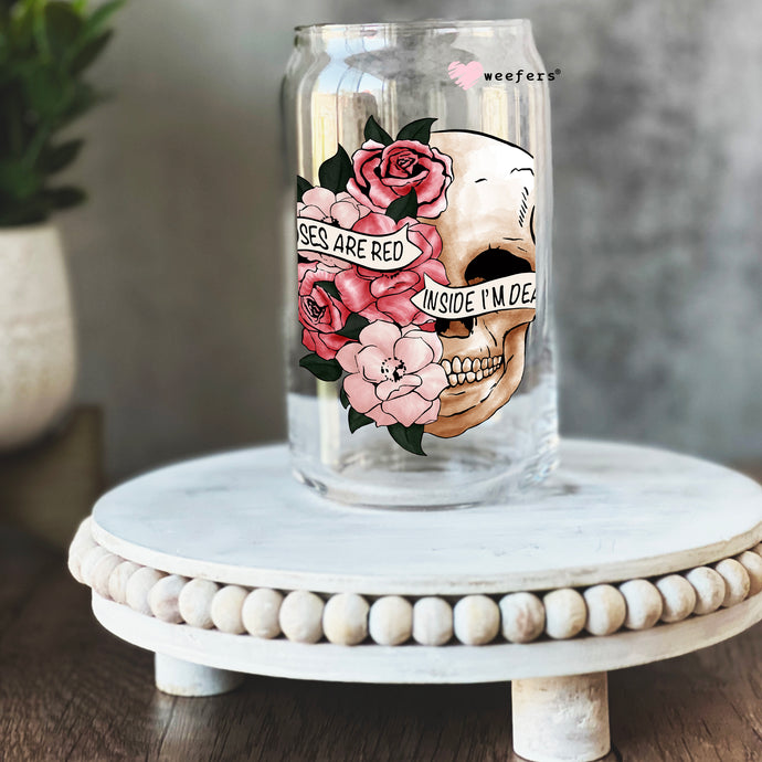 a jar with a skull and flowers painted on it