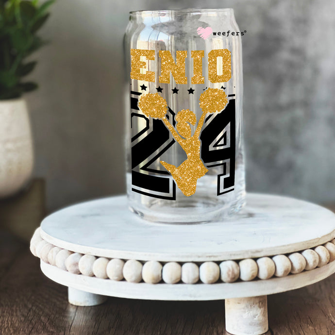 a mason jar with a gold and black design on it