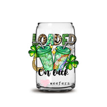 Load image into Gallery viewer, a glass jar filled with liquid and shamrocks
