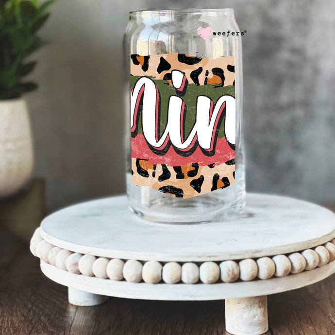 a glass jar with the word fun painted on it