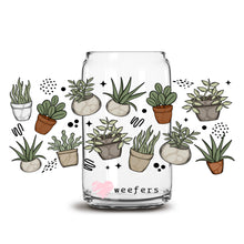 Load image into Gallery viewer, a glass jar filled with potted plants
