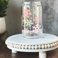 Load image into Gallery viewer, a glass jar with pink and white snowflakes on it
