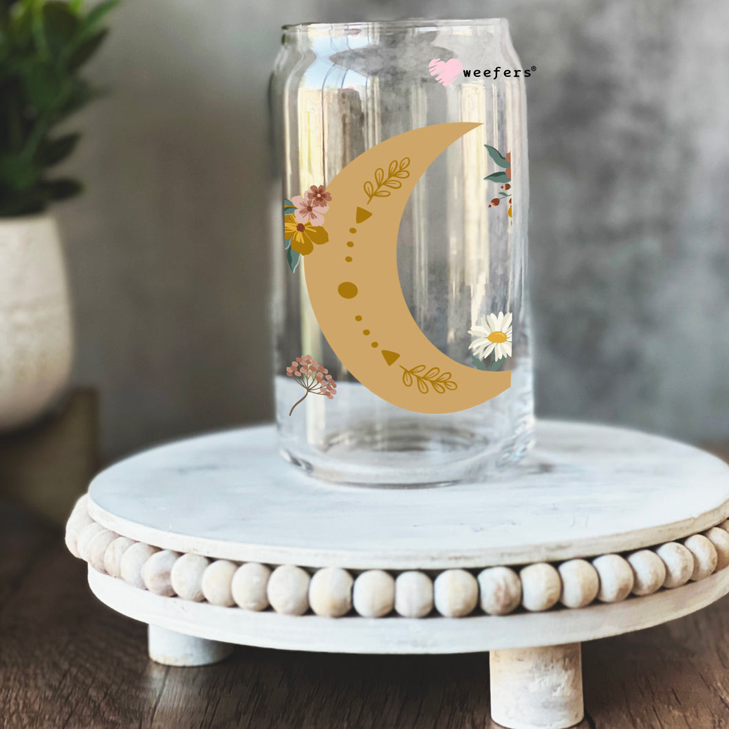 a glass jar with a yellow moon on it