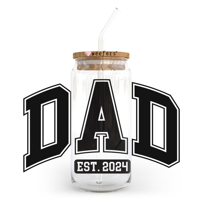 a glass jar with a straw in it with the word dad on it