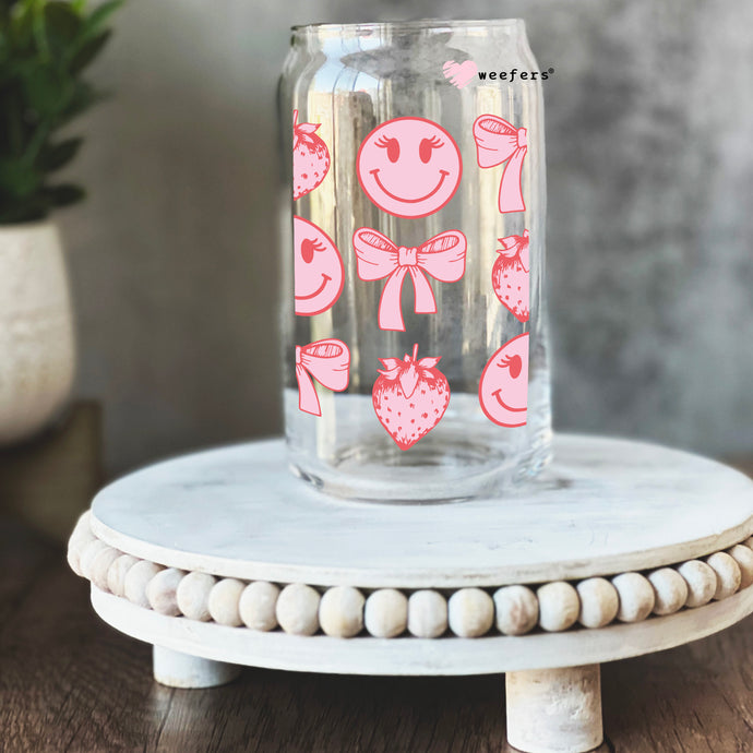 a glass jar with a pink design on it