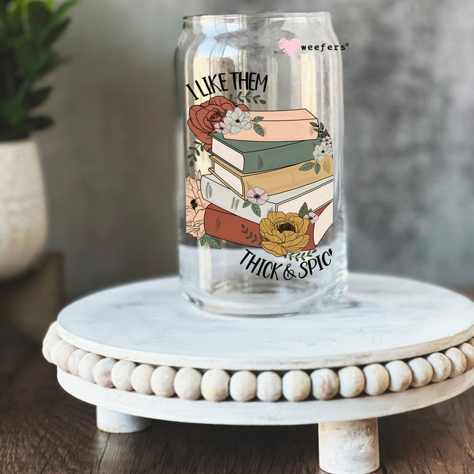 a glass jar with a picture of a stack of books on it