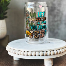 Load image into Gallery viewer, a glass jar with the words let the wild you about
