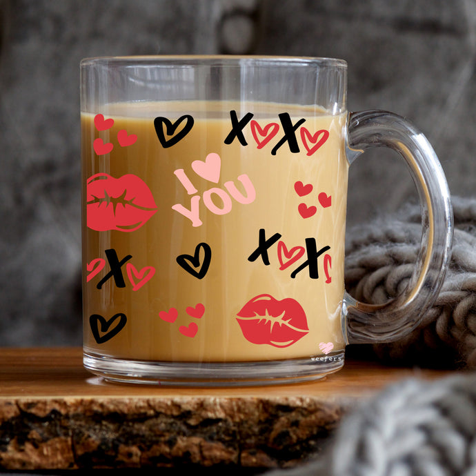 a glass mug with a design on it