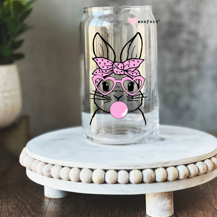 a glass jar with a picture of a bunny wearing glasses