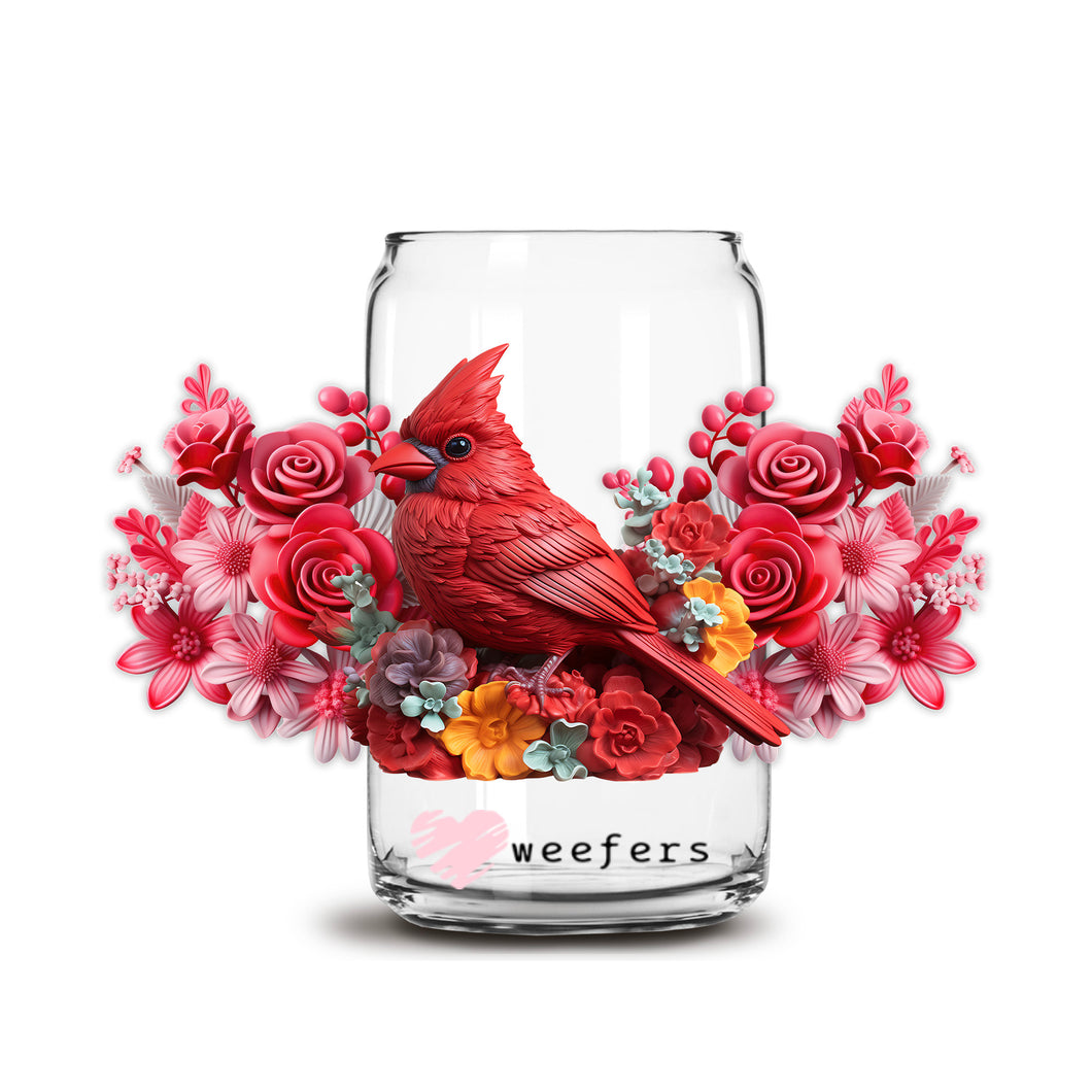 a red bird sitting on top of a vase filled with flowers
