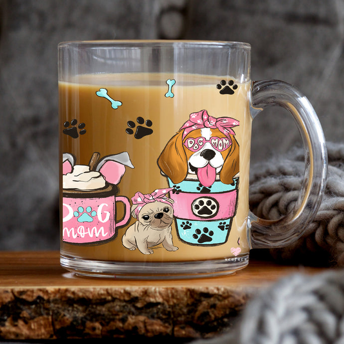 a glass mug with a dog on it