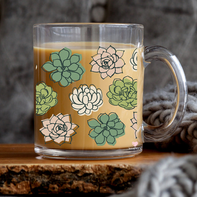 a glass mug with a succulent pattern on it