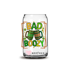 Load image into Gallery viewer, a glass jar filled with beer sitting on top of a table
