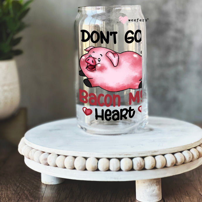 a glass jar with a pig on it