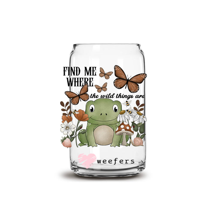 a glass jar with a frog and butterflies on it