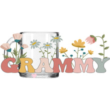 Load image into Gallery viewer, a glass mug with flowers and the wordgrammy
