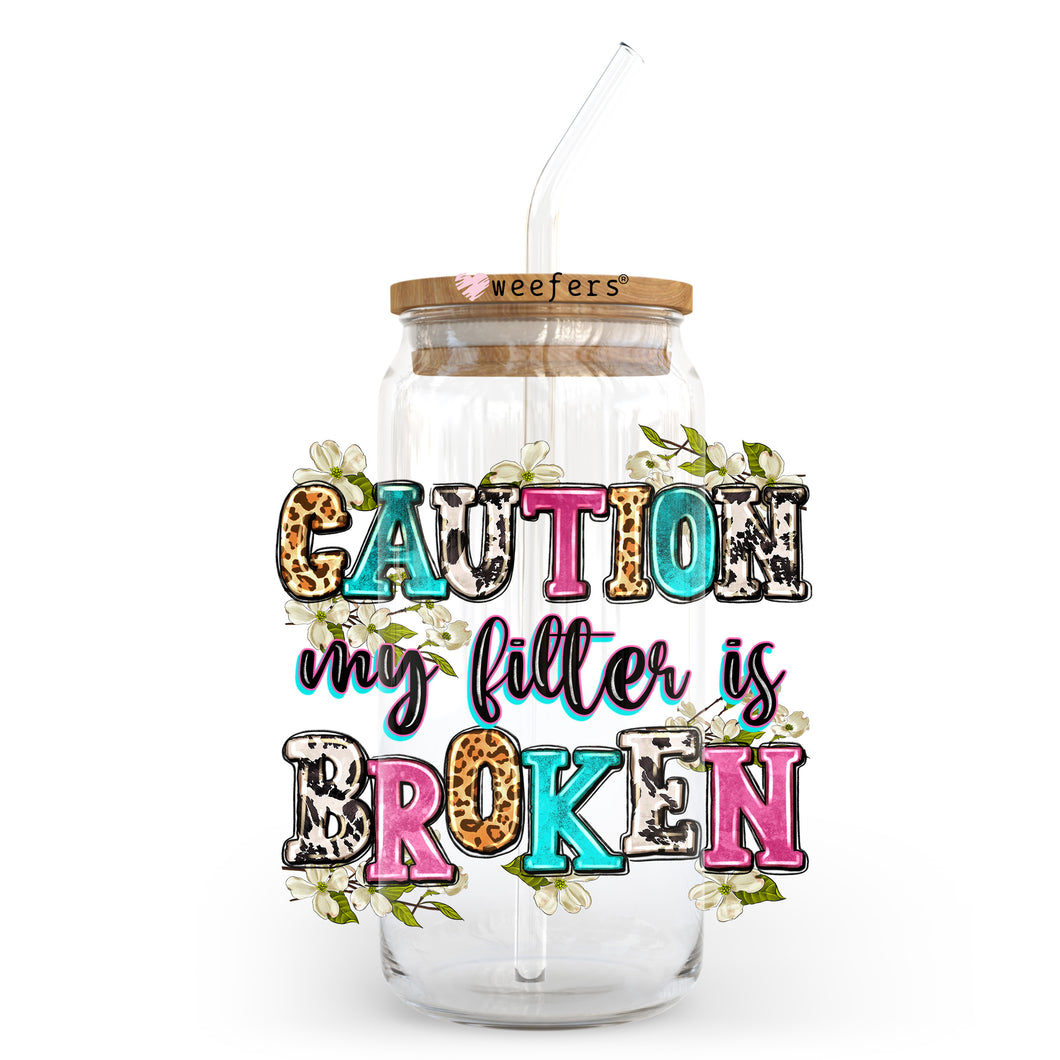 a jar with a straw in it that says caution my litter is broken