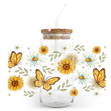 Load image into Gallery viewer, a glass jar with a straw and a straw in it with sunflowers and
