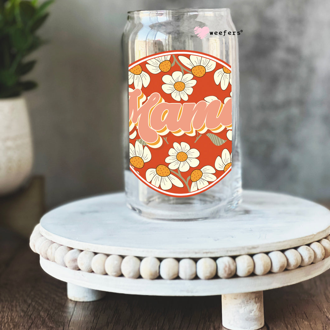 a mason jar with a floral design on it