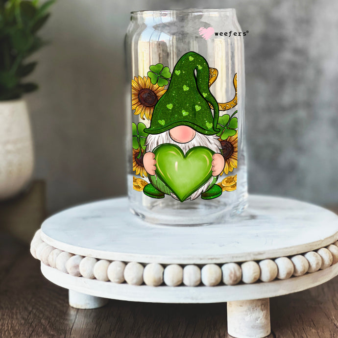 a glass jar with a picture of a gnome holding a heart