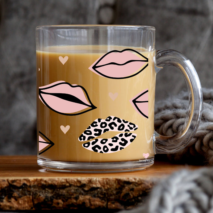 a glass mug with a leopard print on it