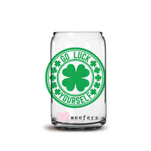 Load image into Gallery viewer, a close up of a glass with a shamrock on it
