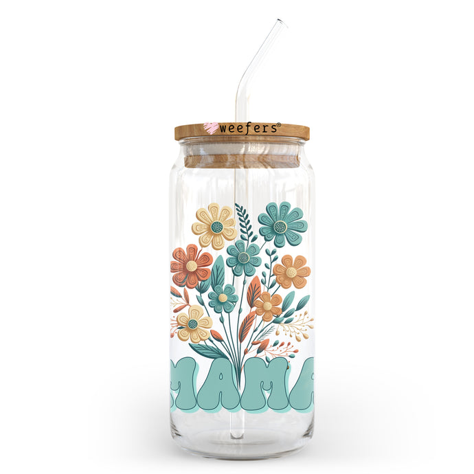 a glass jar with a straw in it with a floral design