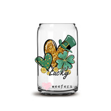 Load image into Gallery viewer, a glass jar filled with gold glitter and shamrocks
