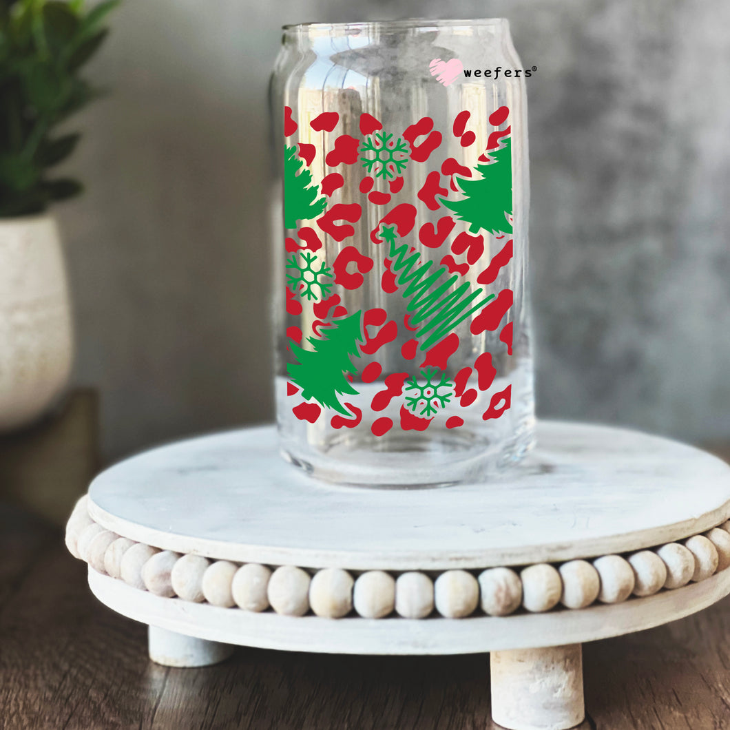 a glass jar with a red and green design on it