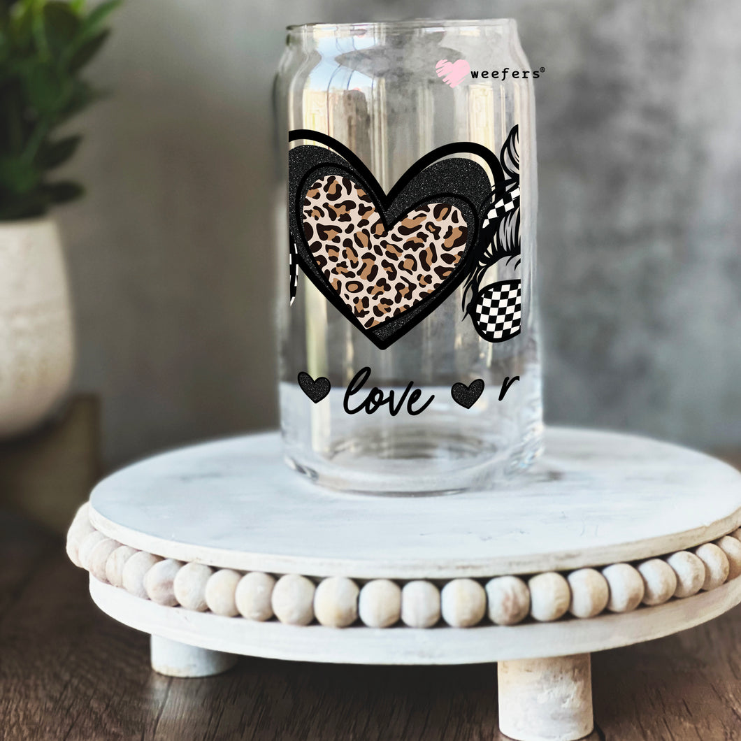 a glass jar with a leopard print heart on it