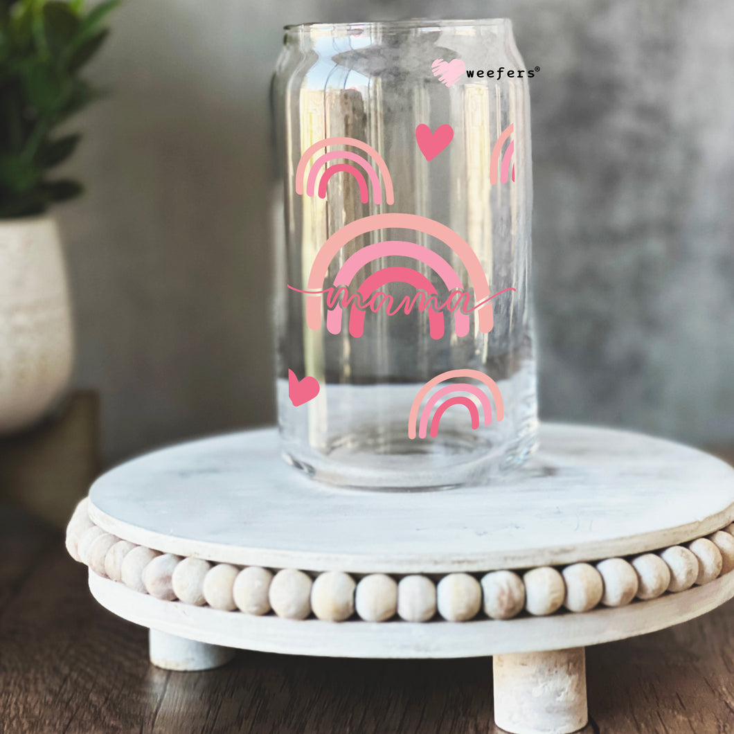 a glass jar with a rainbow painted on it