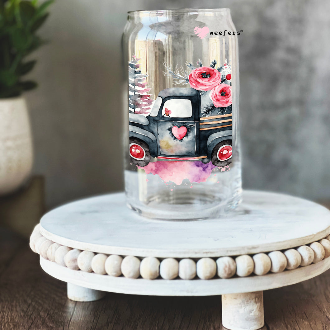 a glass vase with a truck painted on it