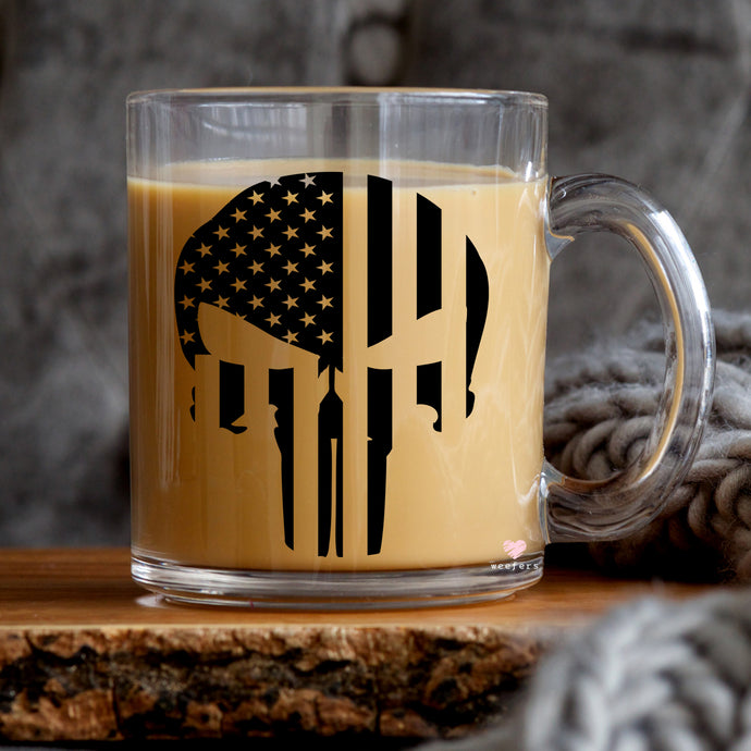 a glass mug with a skull and american flag on it