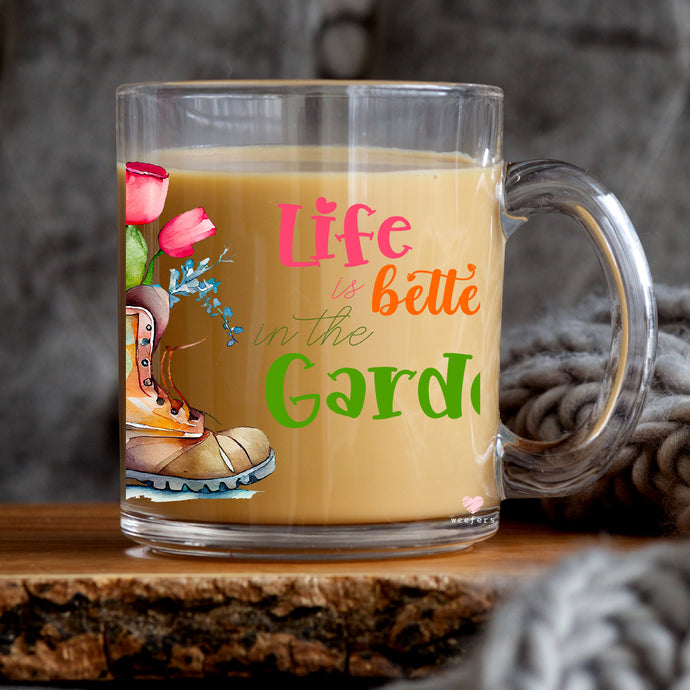 a glass mug with a picture of a boot on it