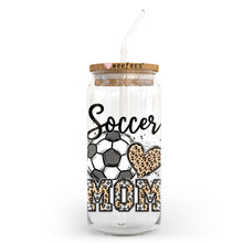 Load image into Gallery viewer, a glass jar with a straw in it that says soccer mom
